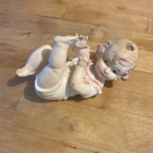 Piano baby playing with her feet marked 5649